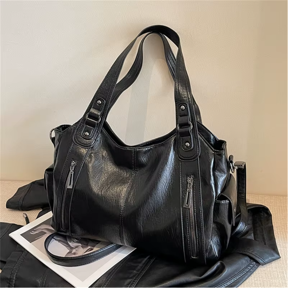 Grand sac à main souple Élégance Cuir, sac à main élégant en cuir souple avec poches et poignées confortables.