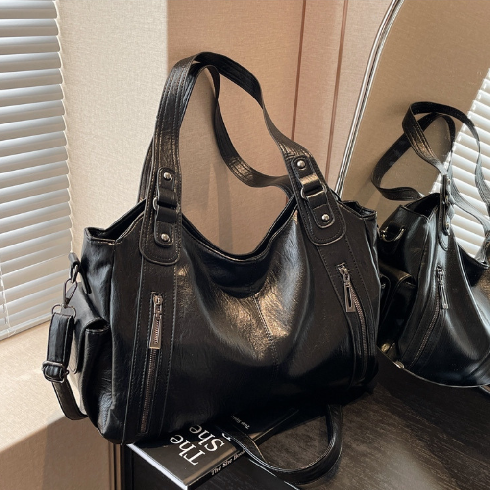 Grand sac à main souple Élégance Cuir Lucie avec poignées en cuir et détails élégants, vue de face sur fond neutre.
