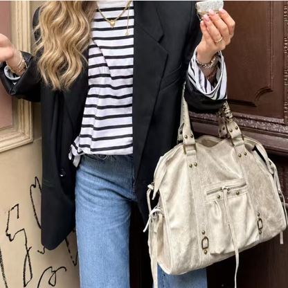 Grand sac de cours étudiant Élégance Cuir, en cuir noir avec poignées robustes et grande capacité pour accessoires et livres.