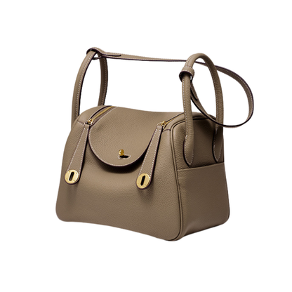 Sac à main bandoulière en cuir Élégance Cuir, modèle Nathalie, avec poignée en cuir et fermeture à pression visible.