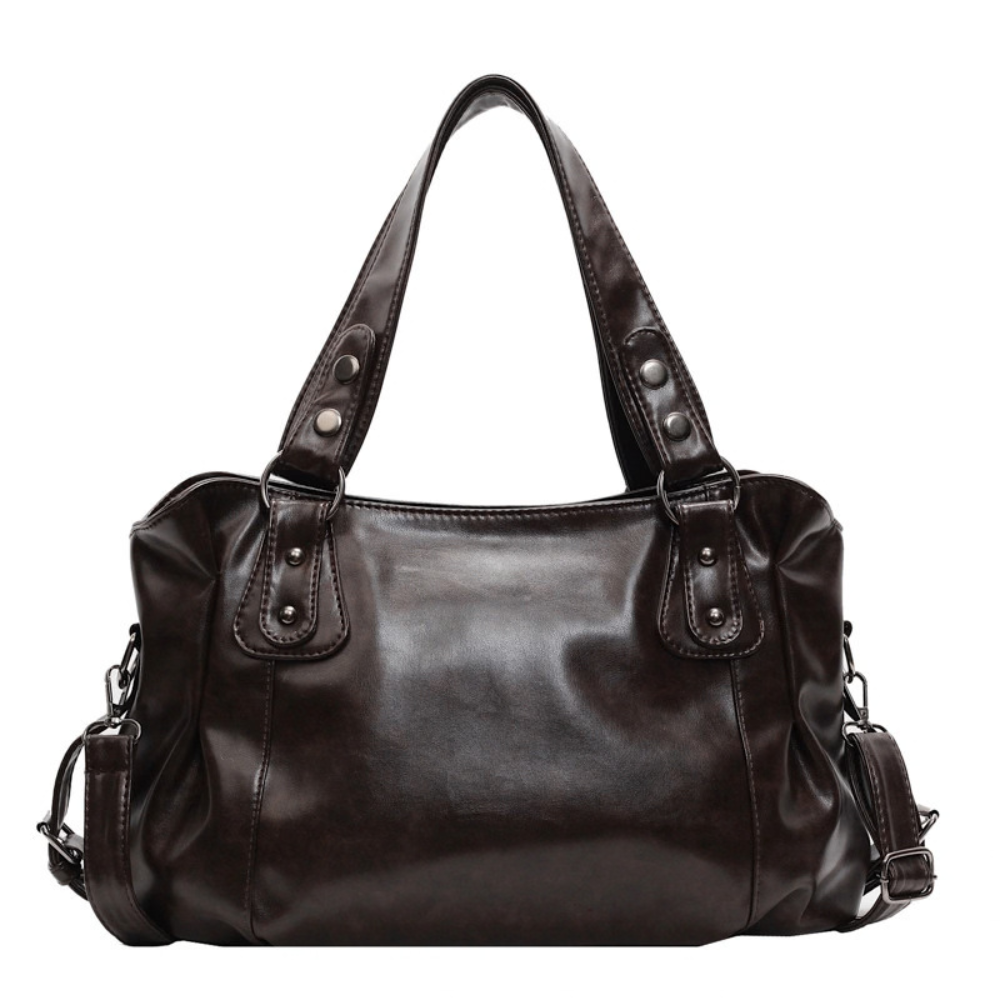 Grand sac à main de cours rétro en cuir souple Élégance Cuir, avec poignées et détails vintage visibles.
