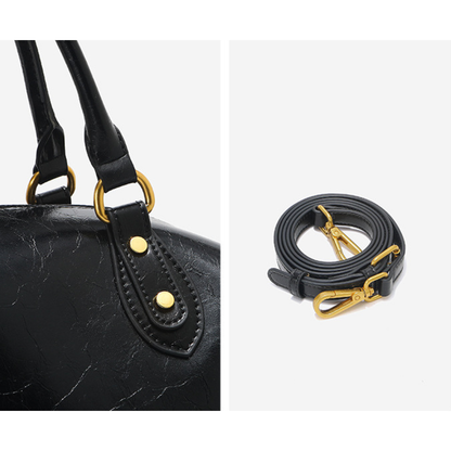 Sac à main femme en cuir noir Élégance Cuir, élégant sac à main en cuir avec poignées et fermeture métallique visible.