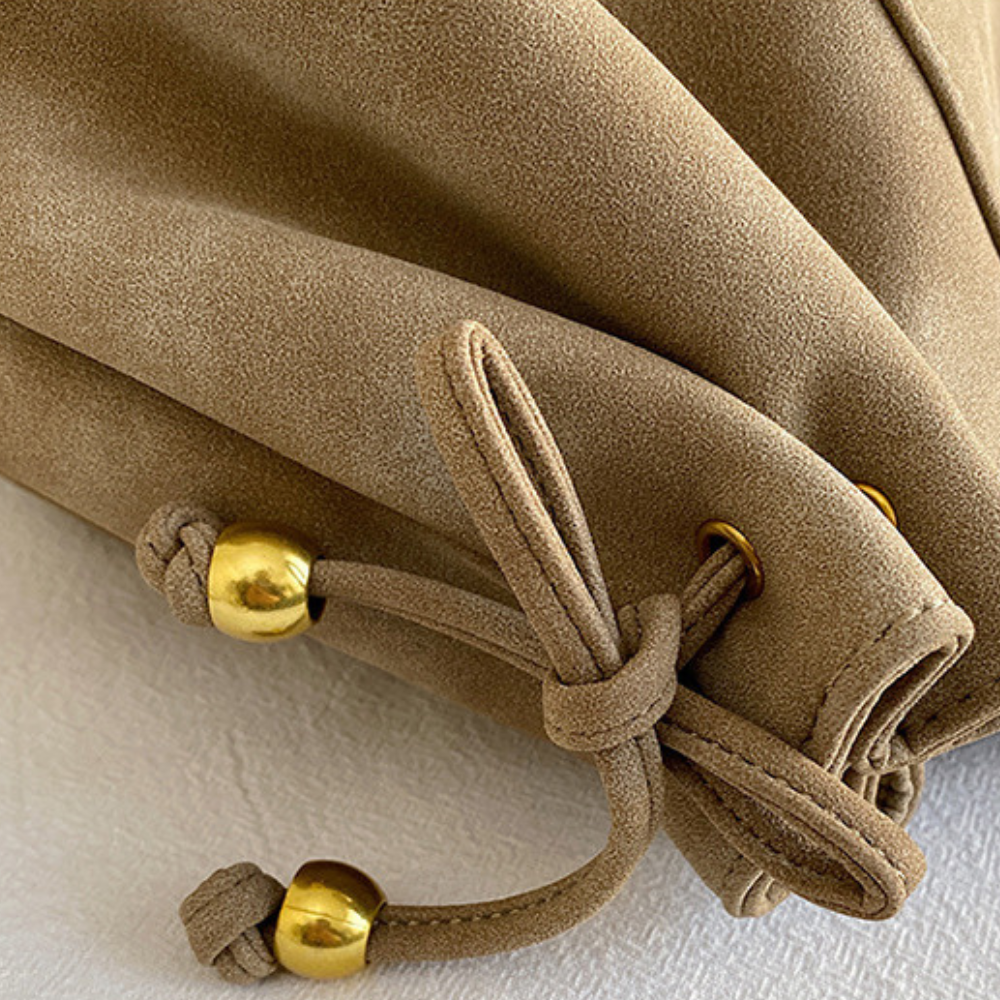 Grand sac à main de cours bowling Élégance Cuir Noemi 2, en cuir marron avec poignées robustes et design élégant.