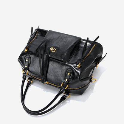 Sac à main femme en cuir noir de la marque Élégance Cuir, avec poches et poignées en cuir, élégant et pratique.
