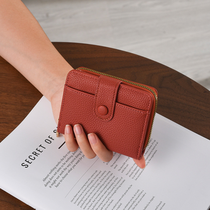 Petit portefeuille pour femme Élégance Cuir, en cuir, avec plusieurs compartiments et fermeture à pression.