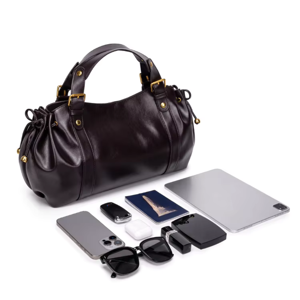 Sac à main vintage Élégance Cuir Noemi en cuir marron avec poignée en métal et détail de fermeture élégante.