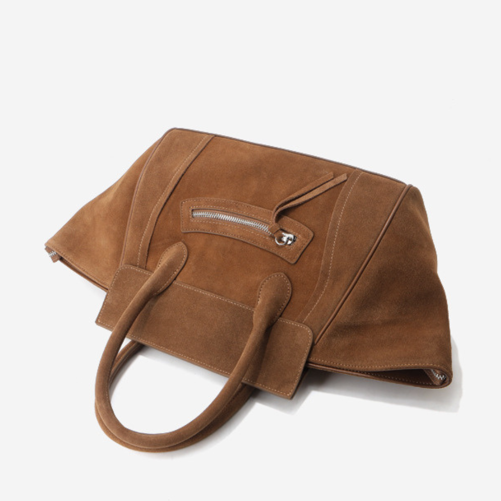 Grand sac cabas en daim pour femme de la marque Élégance Cuir, avec poignées et détails élégants.