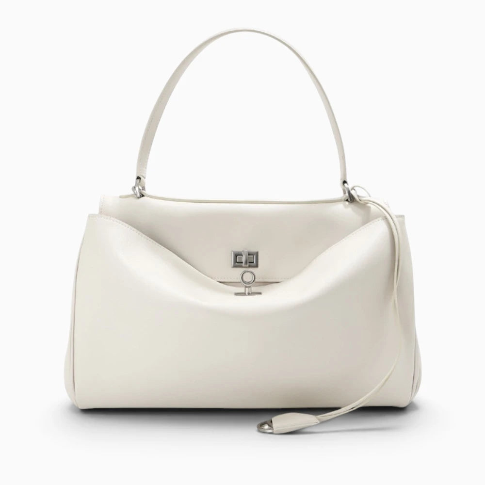 Sac à main cabas femme en cuir blanc de la marque Élégance Cuir, avec poignées et design élégant.