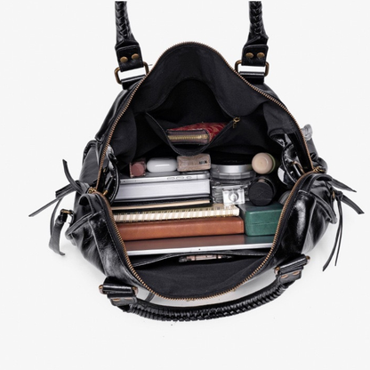 Grand sac de cours étudiant Élégance Cuir, en cuir marron, rempli de livres et fournitures pour étudiants.