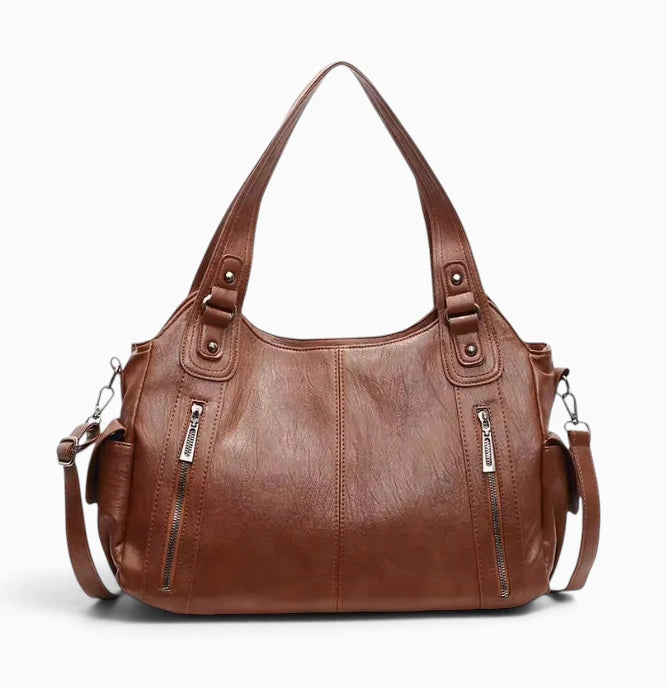 Grand sac à main souple Élégance Cuir Lucie en cuir marron avec poignées et poche extérieure visible.