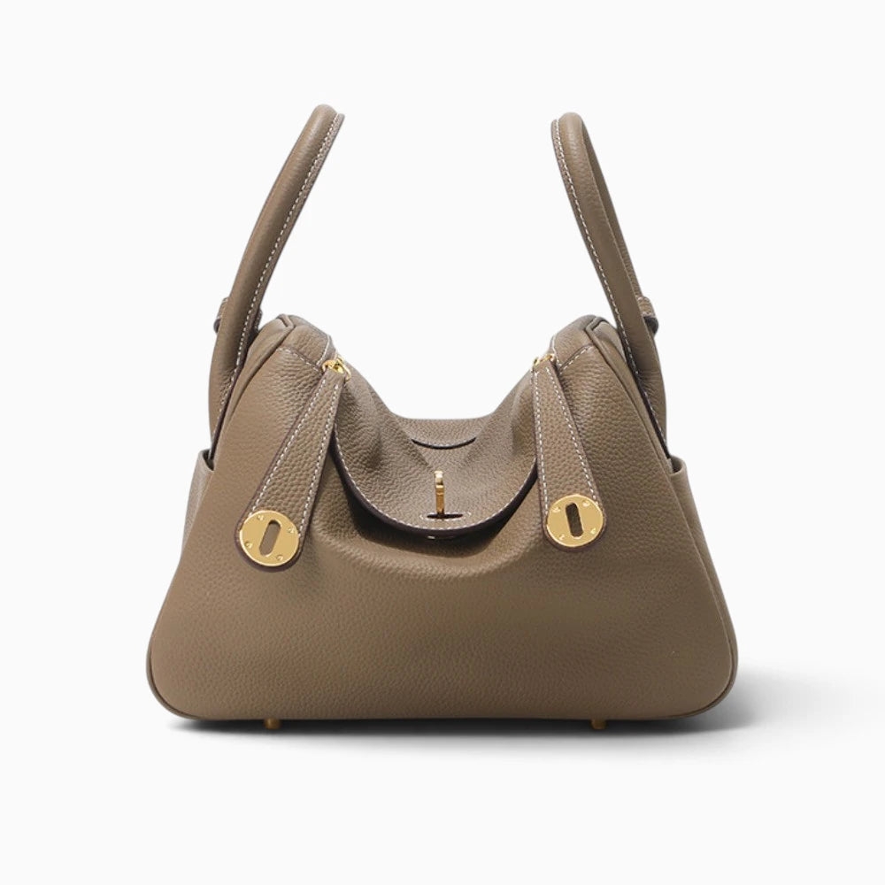 Sac à main bandoulière en cuir beige Élégance Cuir, élégant sac NATHALIE avec poignée et détails raffinés.