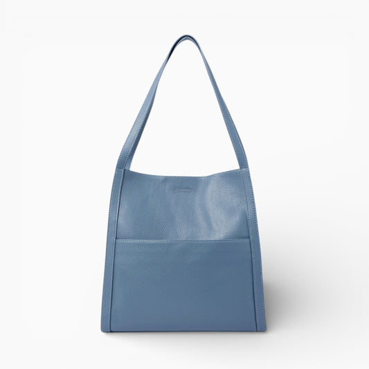 Sac cabas en cuir souple bleu pour femme modèle Lyon d'Élégance Cuir, vue de face avec poignées et détails élégants.