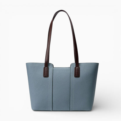 Sac cabas en cuir bleu pour femme, modèle horizontal Monaco, vu de face avec anses élégantes et finitions soignées.
