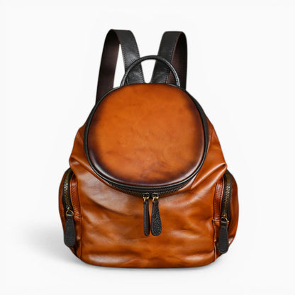 Sac à dos en cuir pour femme, modèle Nostalgie, à format arrondi avec rabat zippé, couleur élégante et design chic.