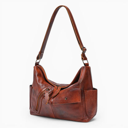 Sac à main en cuir pour femme de la marque Élégance Cuir, modèle Belle Époque avec poches extérieures élégantes vue de coté