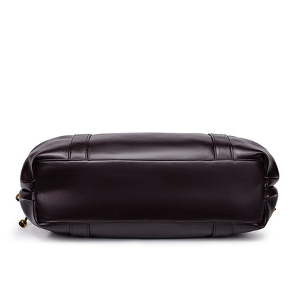 Sac à main vintage Élégance Cuir Noemi avec poignée en cuir et détails élégants, vue de face sur fond neutre.