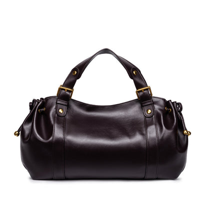 Sac à main vintage Noemi de la marque Élégance Cuir, en cuir marron avec poignées et fermeture métallique visible.