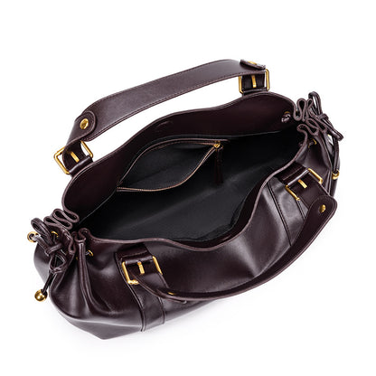 Sac à main vintage Élégance Cuir Noemi avec intérieur en cuir marron et détails élégants, finition raffinée.