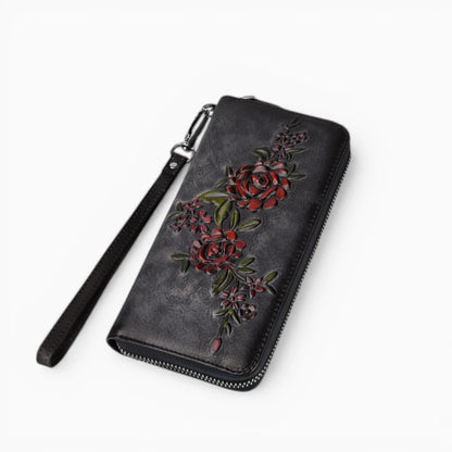 Portefeuille femme en cuir noir avec motif floral et fermeture zip