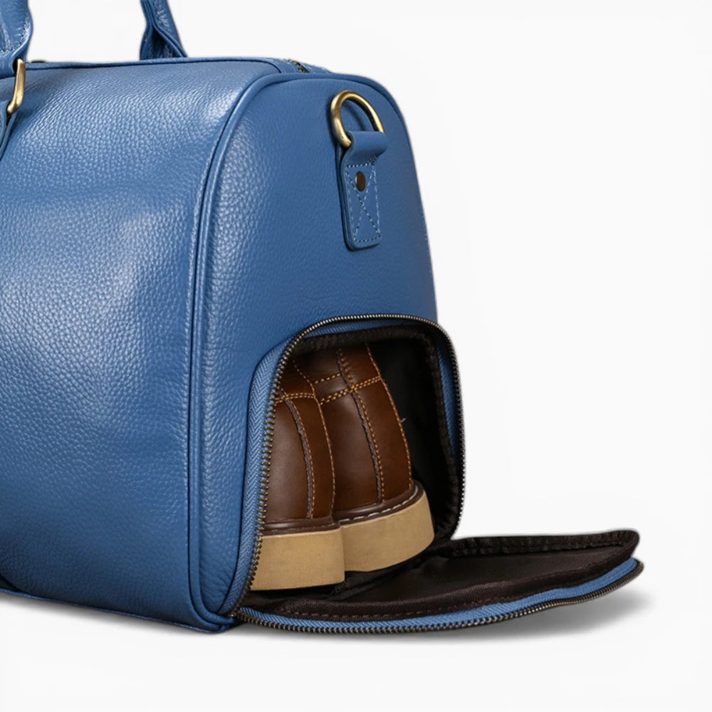 Sac de voyage en cuir bleu avec compartiment chaussures ouvert