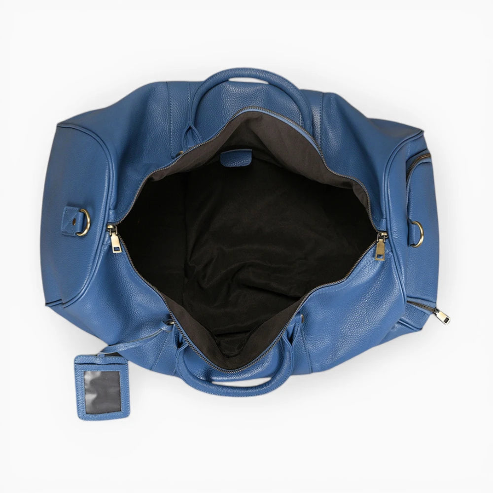 Sac de voyage en cuir bleu avec intérieur spacieux vu de dessus