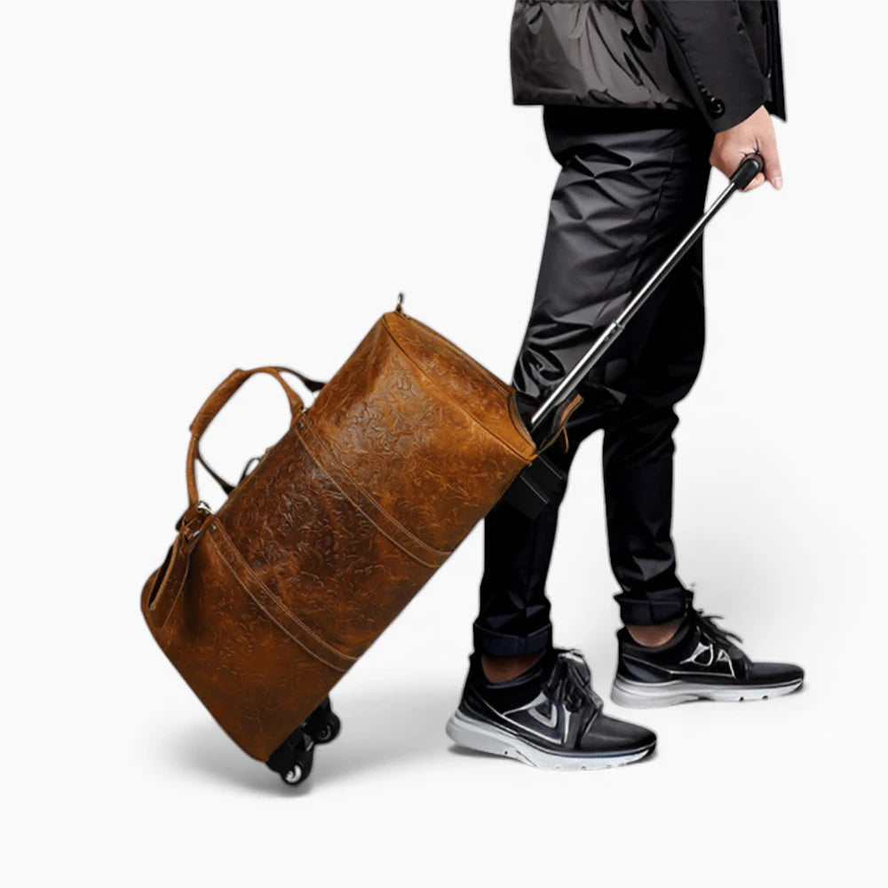 Sac de voyage en cuir marron avec roulettes tiré à la main