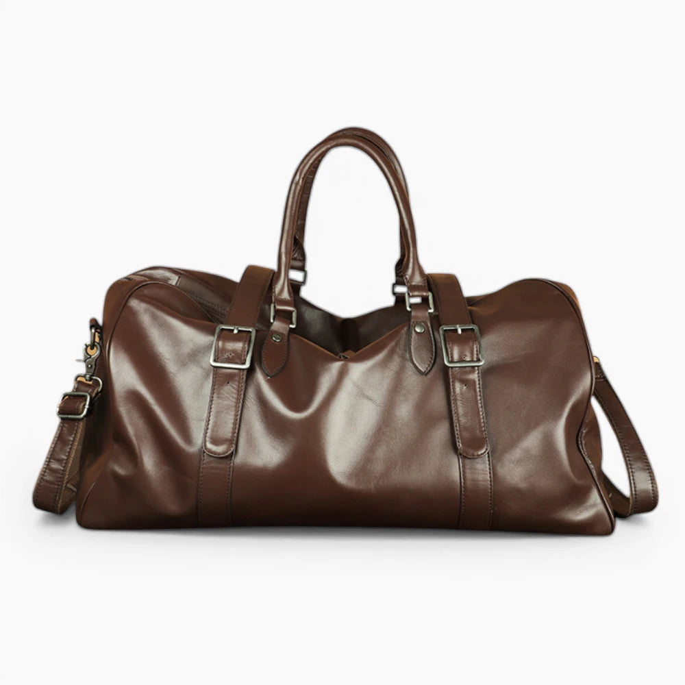 Sac de voyage en cuir marron vue de face avec bandoulière